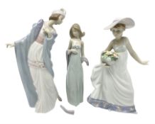 Three Lladro figures of ladies comprising 'The Flirt' model no 5789
