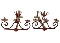 Pair of red painted three branch candle wall sconces