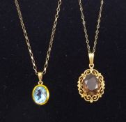 9ct gold oval blue topaz pendant necklace and a 9ct gold smoky quartz pendant necklace