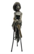 Art Deco style bronze modelled as a female figure seated cross legged upon a chair