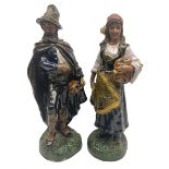 Pair of late 19th century continental glazed stoneware Black Forest style figures