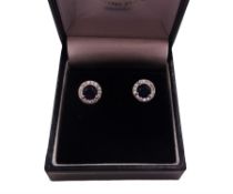 Pair of silver blue and clear cubic zirconia stud earrings