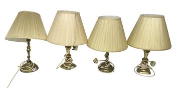 Four brass table lamps with pleated lampshades