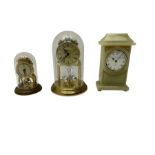 Two contemporary battery driven quartz mantle clocks and a spring driven balance wheel clock