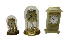 Two contemporary battery driven quartz mantle clocks and a spring driven balance wheel clock