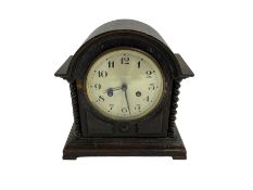 Striking mantle clock in an oak case