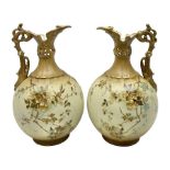 Pair of Turn Vienna blush ivory ewers decorated with floral sprays and gilt