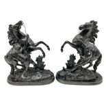 Pair of spelter figural statues of man and rearing horse