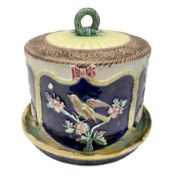 Majolica cheese dome and cover decorated with birds amongst foliage in relief on a blue ground