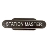 Cast iron Station Master wall plaque on a brown ground