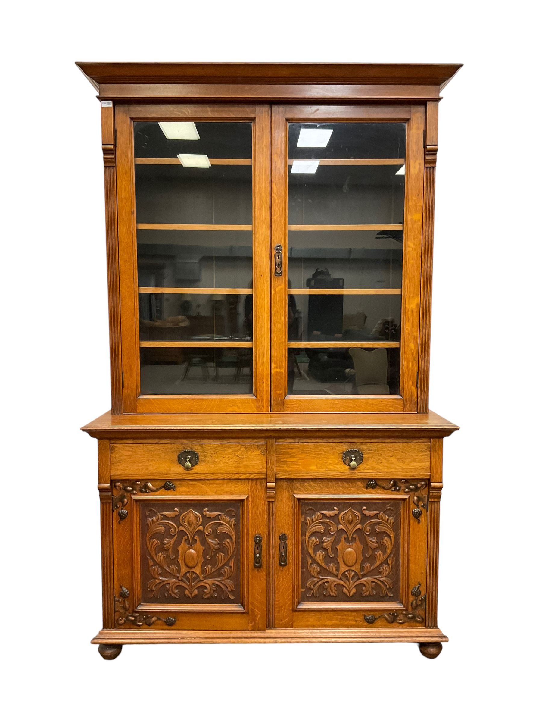 Late 19th century oak bookcase on cupboard