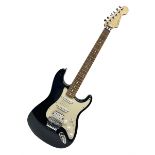 Mexican Fender Stratocaster electric guitar in black c2003 with Floyd Rose tremolo system