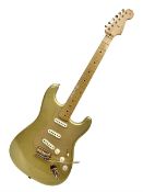 Fender Stratocaster 50th Anniversary 2004 metallic gold electric guitar; serial no.MZ4116369; L98cm;