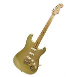 Fender Stratocaster 50th Anniversary 2004 metallic gold electric guitar; serial no.MZ4116369; L98cm;