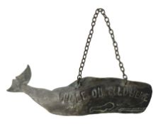 Copper wall hanging sign in the form of a whale