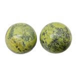 Pair of green serpentine spheres