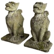 Pair of weathered cast stone grotesque garden figures