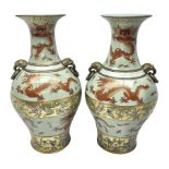 Pair of early 20th century Chinese vases decorated with dragons chasing a flaming pearl