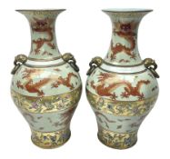 Pair of early 20th century Chinese vases decorated with dragons chasing a flaming pearl