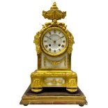 French late 19th century 8-day gilt ormolu mantle clock on a padded base - with urn surmount and flo