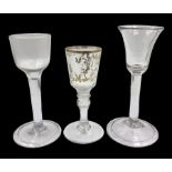 Three 18th century wine glasses comprising a plain stemmed glass with bell shaped bowl and conical f