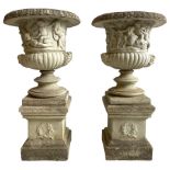Large pair of cast stone three-piece Grecian urns