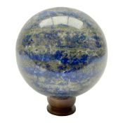 Lapis lazuli sphere upon a carved wooden base