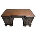 Chippendale design mahogany reverse break-front twin pedestal desk