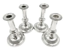 Four George III silver candlesticks