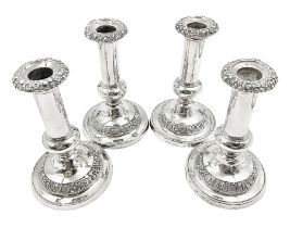 Four George III silver candlesticks