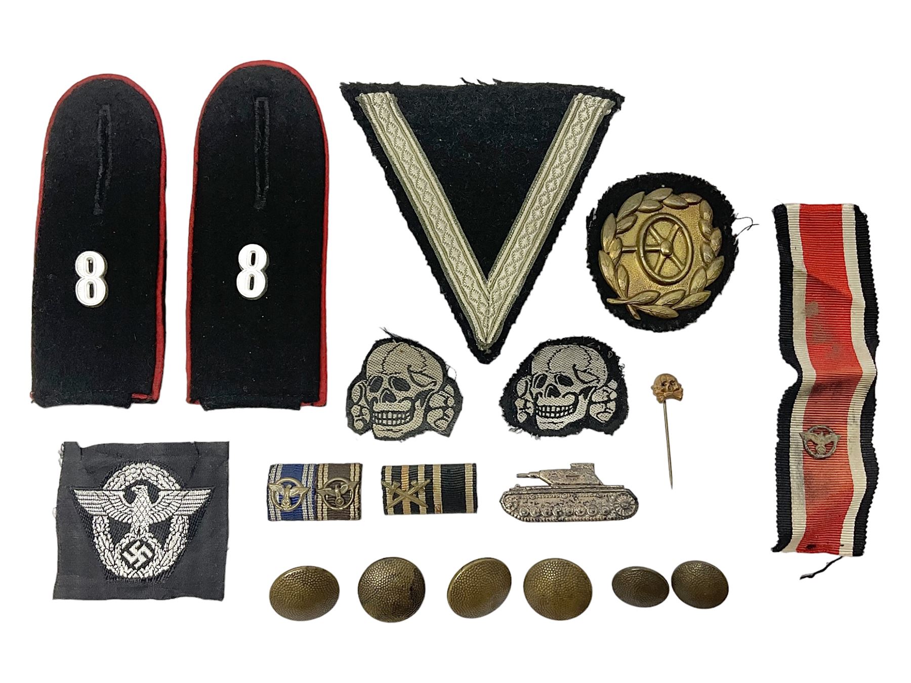 Collection of eleven German metal and cloth badges and uniform buttons including driver's badge