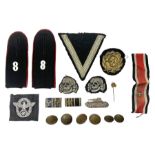 Collection of eleven German metal and cloth badges and uniform buttons including driver's badge
