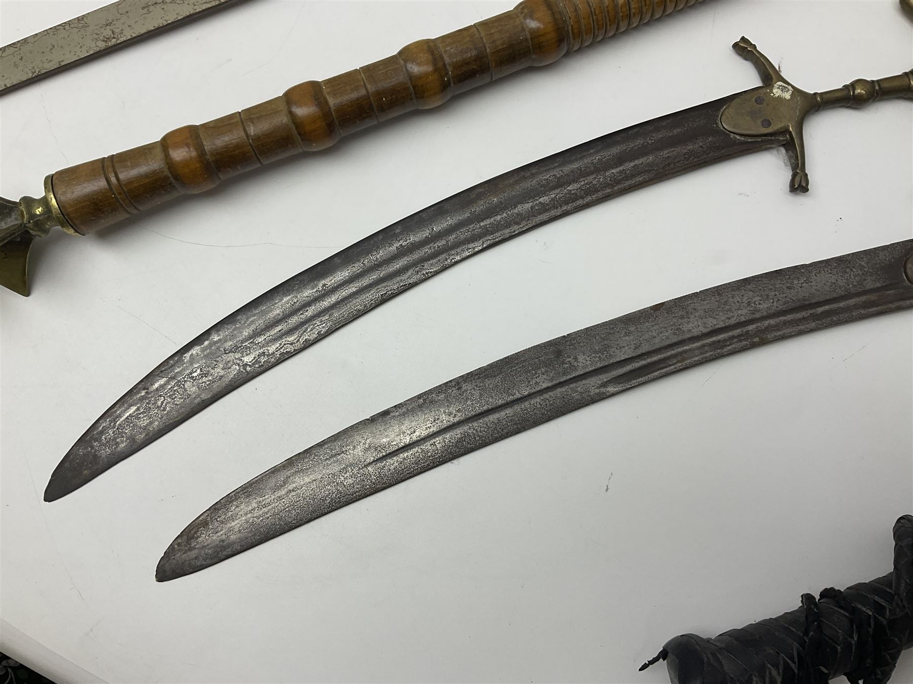 Near pair of short swords each with slightly curving 41cm fullered steel blade and all brass H-shape - Image 14 of 19