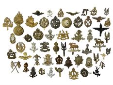 Over fifty metal cap badges and collar dogs including SAS