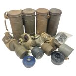 Four WW2 French gas masks in tins with some accessories