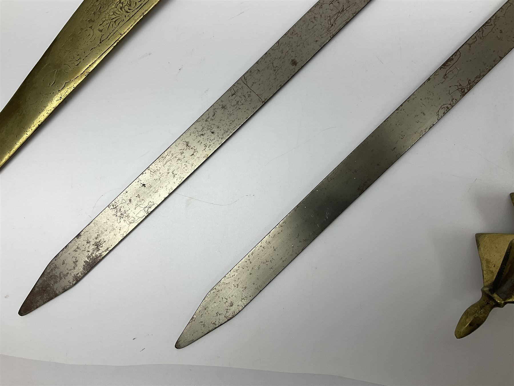 Near pair of short swords each with slightly curving 41cm fullered steel blade and all brass H-shape - Image 6 of 19