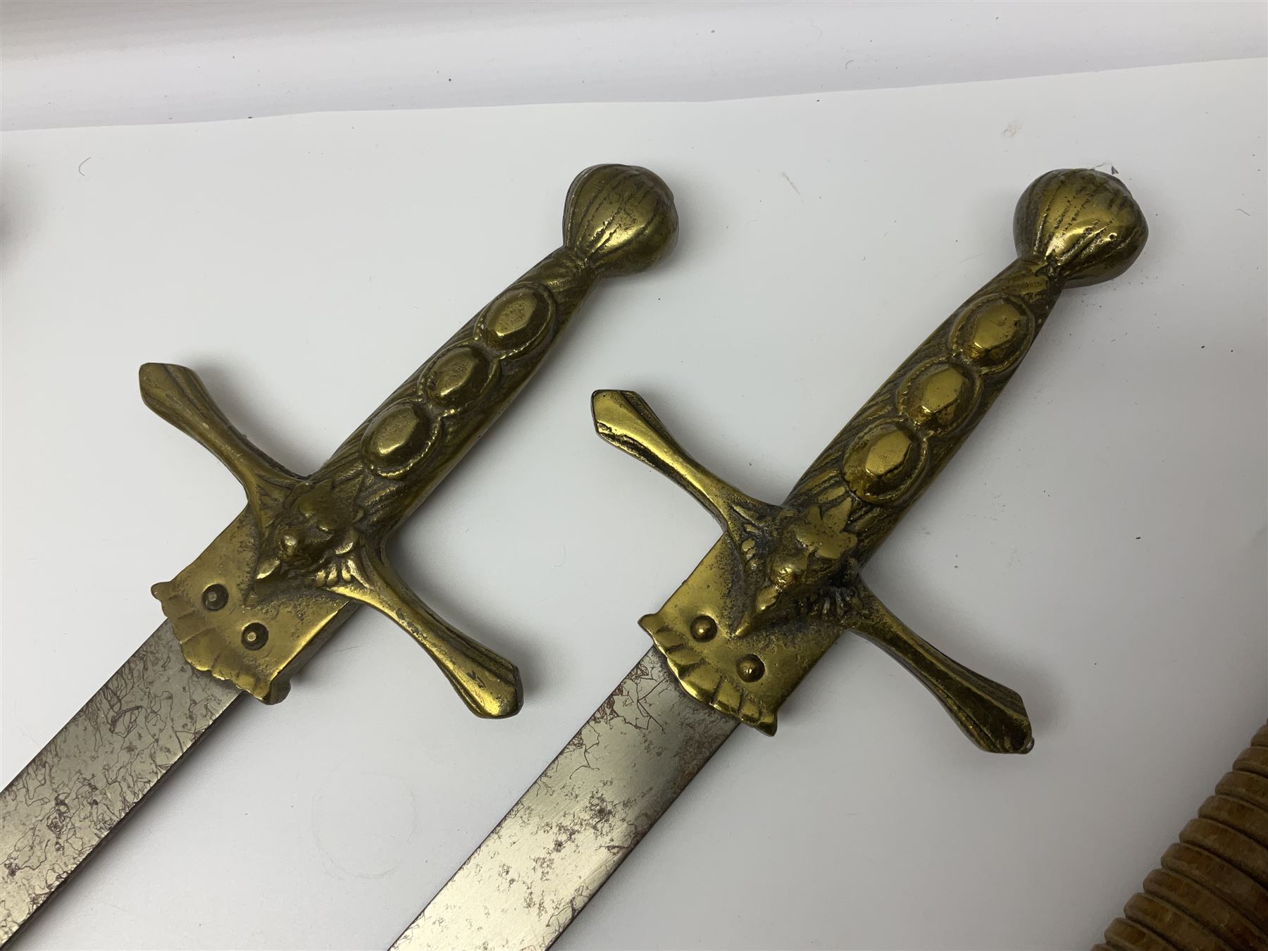 Near pair of short swords each with slightly curving 41cm fullered steel blade and all brass H-shape - Image 4 of 19