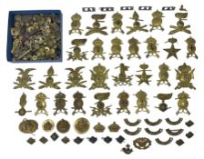 Over thirty British and Continental military metal badges; together with quantity of shoulder titles