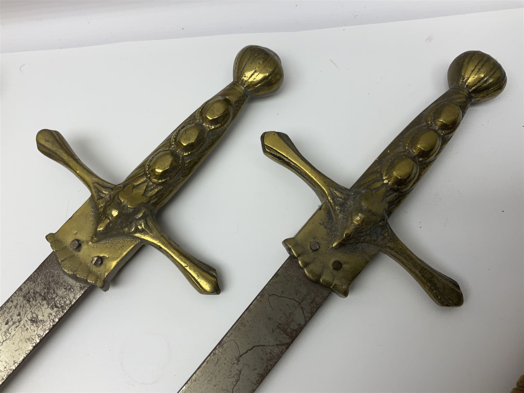 Near pair of short swords each with slightly curving 41cm fullered steel blade and all brass H-shape - Image 3 of 19