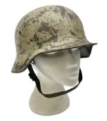 WW2 German Infantry M40 steel helmet with tropical finish and traces of single decal; with chin stra