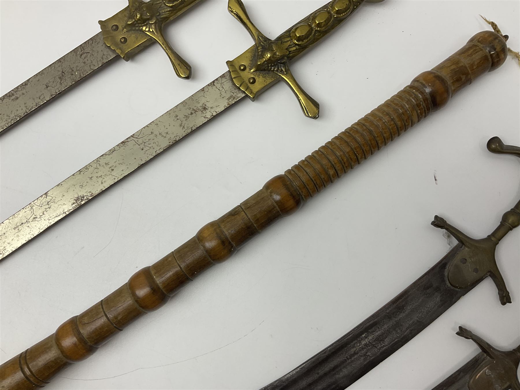 Near pair of short swords each with slightly curving 41cm fullered steel blade and all brass H-shape - Image 10 of 19