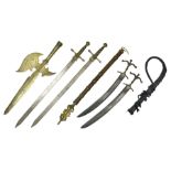 Near pair of short swords each with slightly curving 41cm fullered steel blade and all brass H-shape