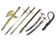 Near pair of short swords each with slightly curving 41cm fullered steel blade and all brass H-shape