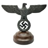 WW2 German cast white metal desk ornament/paperweight as the eagle insignia on later turned mahogany