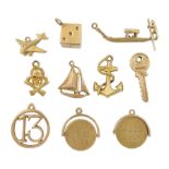 14ct gold dice charm and nine 9ct gold charms including anchor