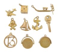 14ct gold dice charm and nine 9ct gold charms including anchor