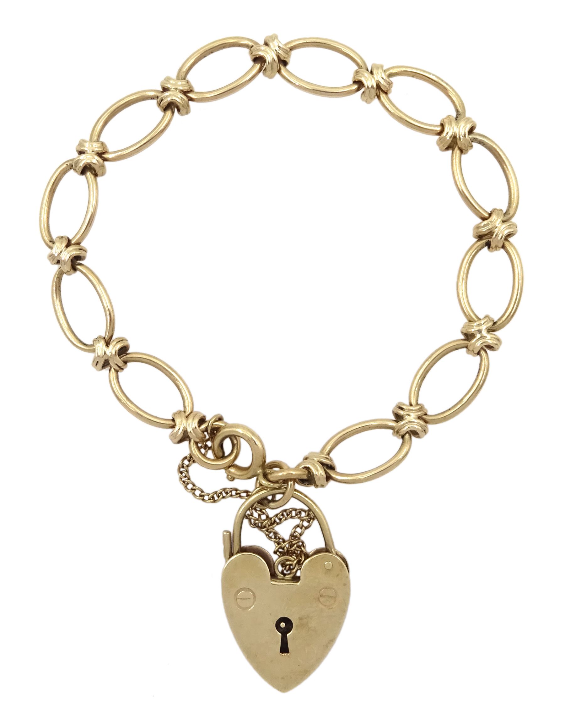 9ct gold oval link bracelet with heart locket clasp