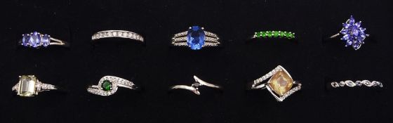 Ten silver stone set rings
