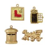 Four 9ct gold pendant/charms including telephone box