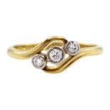 Early 20th century gold milgrain set three stone old cut diamond crossover ring